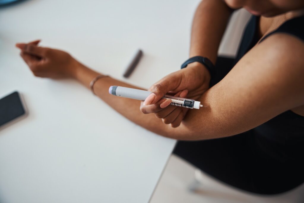 afro american young woman doing vitamin injection 2023 11 27 05 19 04 utc