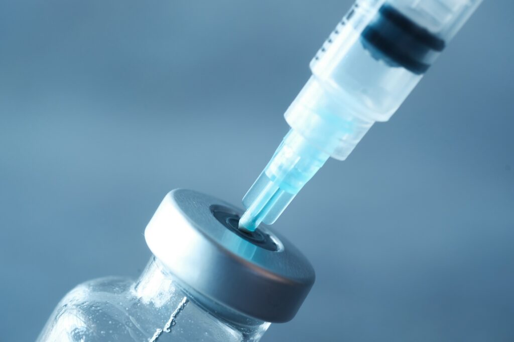 glass vial and syringe on black background 2023 11 27 05 31 48 utc