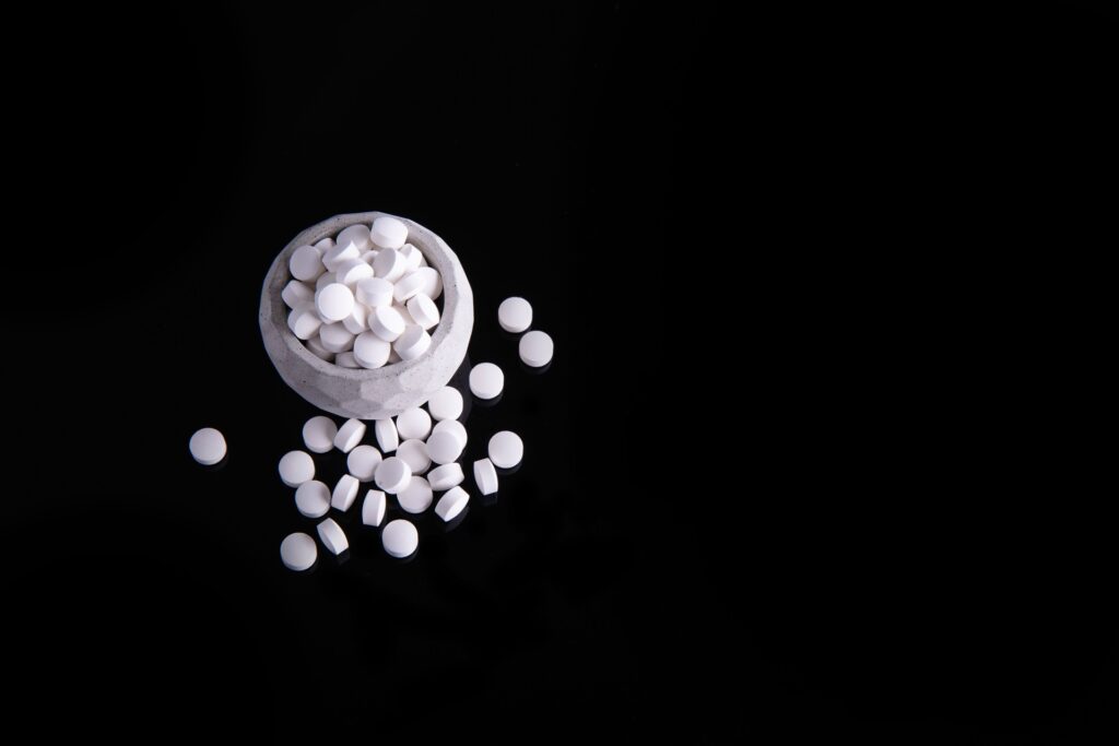 high angle shot of white round medicines in the cu 2023 11 27 05 08 42 utc