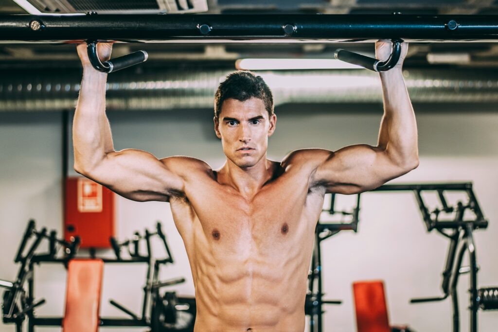 muscular man doing chin ups 2023 11 27 05 16 44 utc