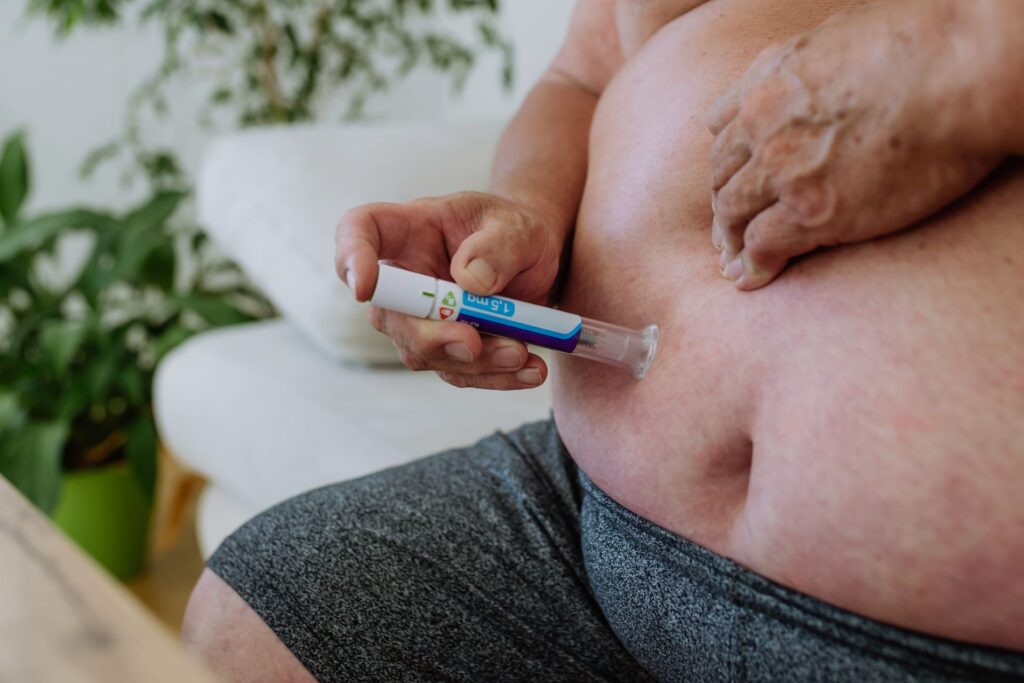 close up of diabetic man using continuous glucose 2023 11 27 05 21 17 utc